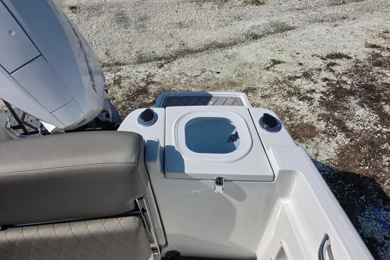 Slide: The Image of 2026 Finseeker 220 CC boat interior with seating and storage compartment. - 17