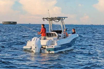 Slide: The Image of Manufacturer Provided Image: 2026 Finseeker 220 CC boat with people fishing on open water. - 1