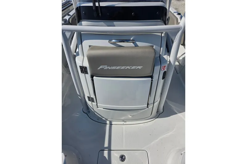 Slide: The Image of 2026 Finseeker 220 CC boat interior with branded seat and storage compartment. - 22