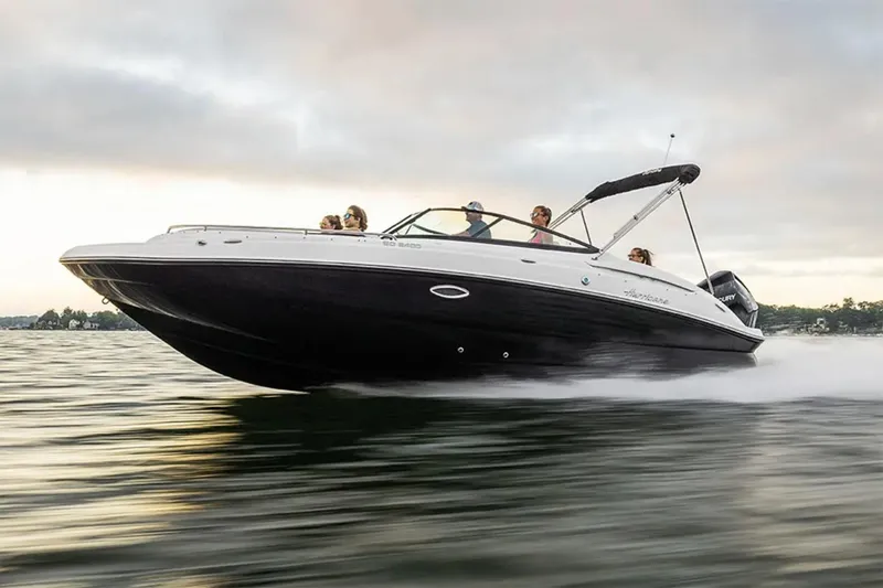 Slide: The Image of Manufacturer Provided Image: 2026 Hurricane SunDeck 2400 OB cruising on water at high speed, with passengers enjoying the ride. - 4