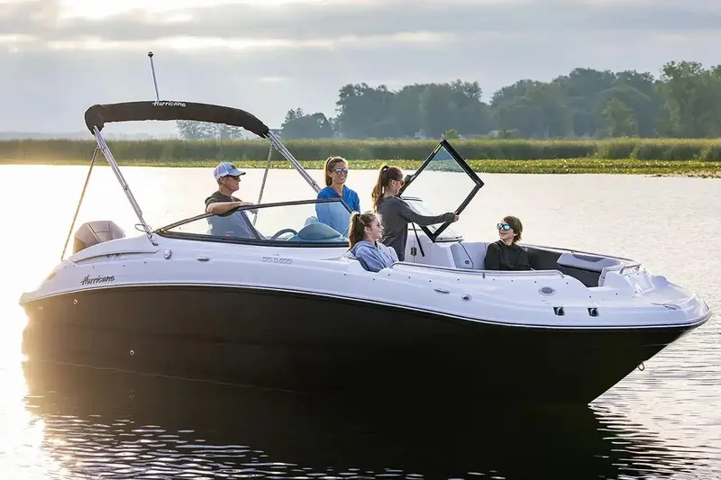 Slide: The Image of Manufacturer Provided Image: 2026 Hurricane SunDeck 2400 OB boat with passengers enjoying a sunny day on the water. - 6