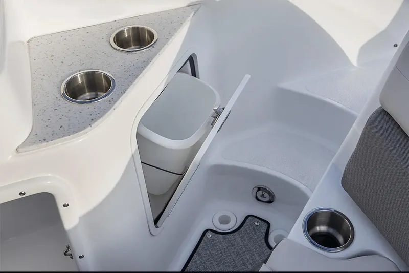 Slide: The Image of Manufacturer Provided Image: 2026 Hurricane SunDeck 2400 OB boat interior with cup holders and storage compartment. - 7
