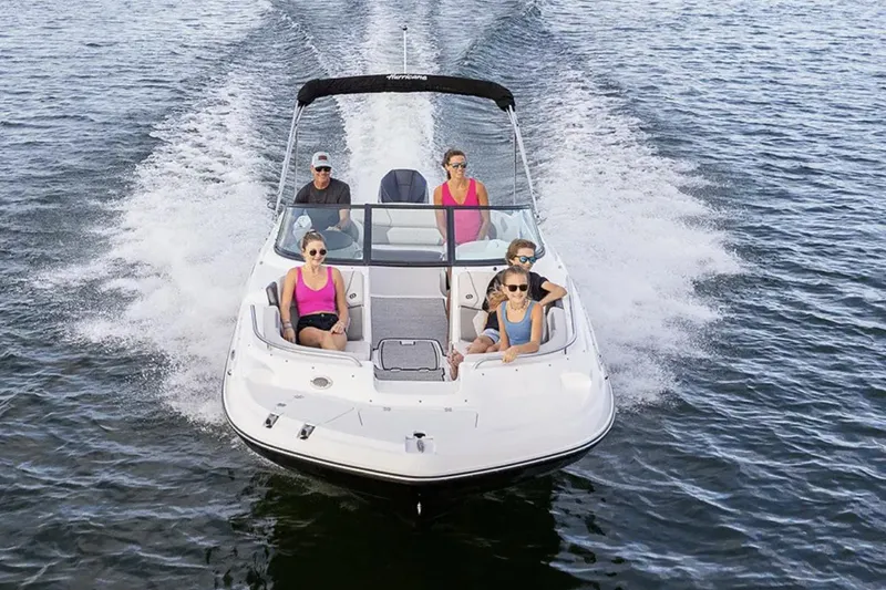 Slide: The Image of Manufacturer Provided Image: 2026 Hurricane SunDeck 2400 OB cruising on open water with passengers enjoying the ride. - 3