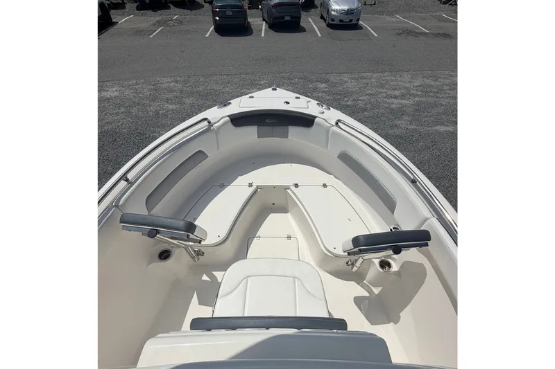 Slide: The Image of 2021 Robalo R222 Center Console boat interior with seating and storage compartments. - 14