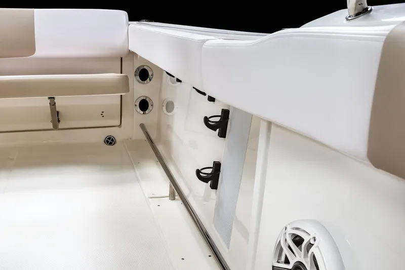 Slide: The Image of Manufacturer Provided Image: 2021 Robalo R222 Center Console boat interior with rod holders and speaker. - 7