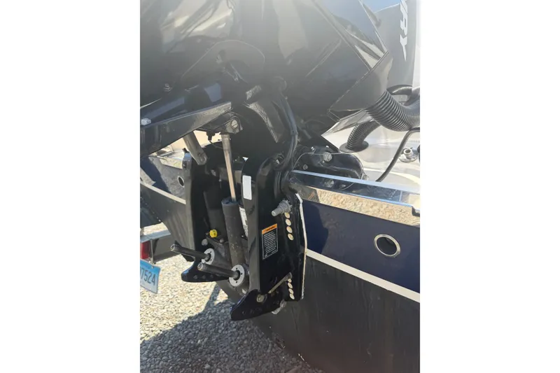 Slide: The Image of 2021 Robalo R222 Center Console boat engine detail in sunlight. - 5