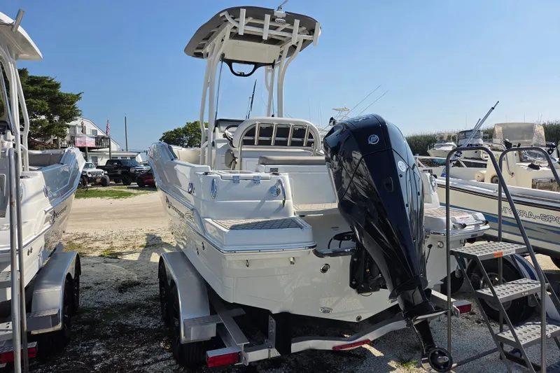 Slide: The Image of 2026 Finseeker 210 CC boat on trailer, featuring powerful outboard motor. - 15