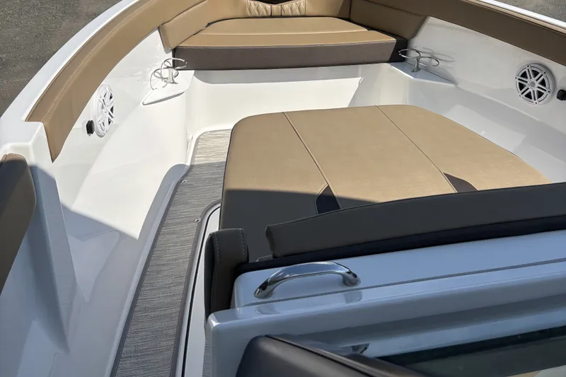 Slide: The Image of 2027 Monterey Elite 25 OB boat interior with tan seating and modern design. - 3