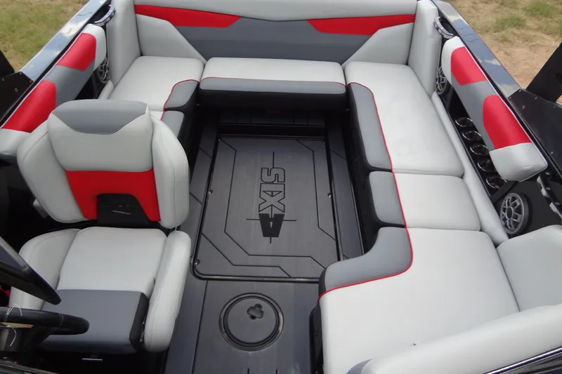 Slide: The Image of 2020 Axis A22 boat interior with gray and red seating, featuring spacious layout and modern design. - 15