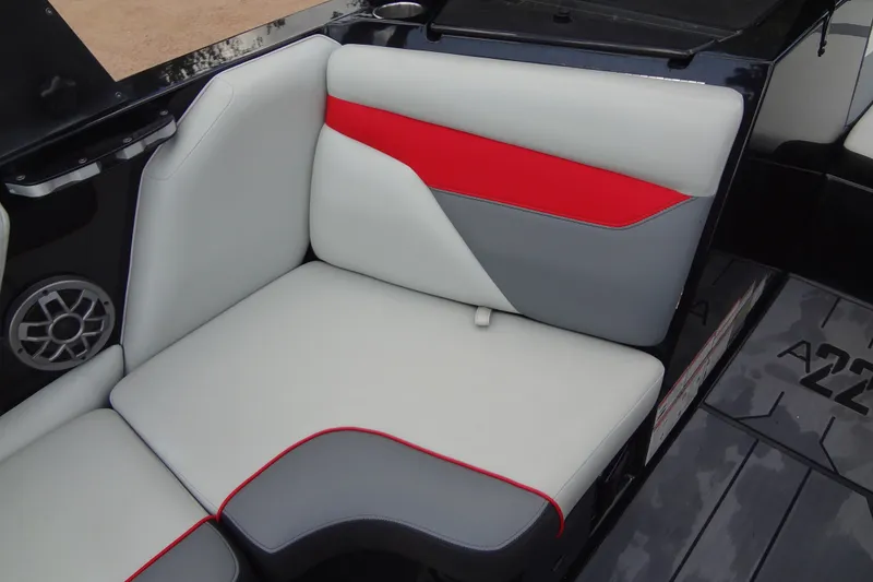 Slide: The Image of 2020 Axis A22 boat interior with stylish red, gray, and white seating. - 16