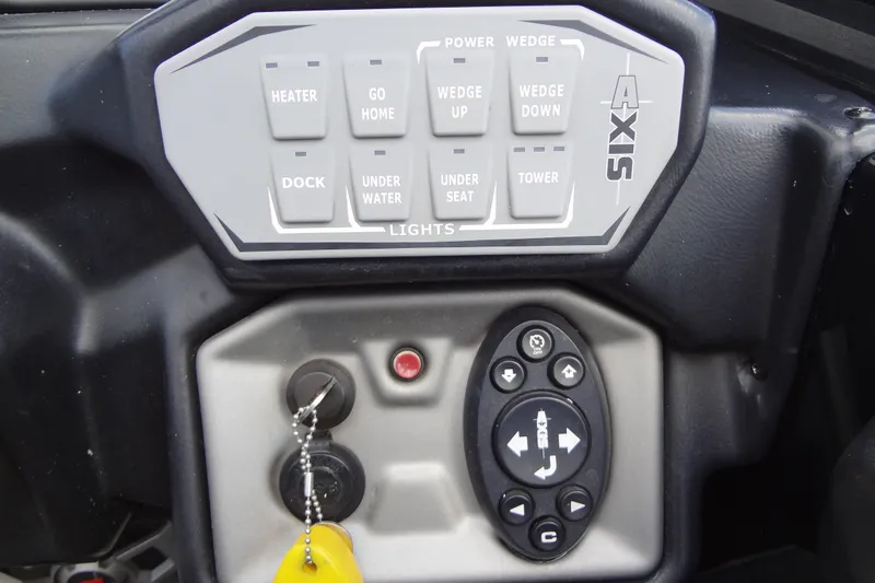 Slide: The Image of Control panel of a 2020 Axis A22 boat with various function buttons. - 28