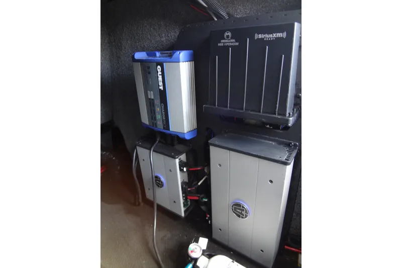 Slide: The Image of 2020 Axis A22 boat audio system components, including amplifiers and wiring setup. - 30