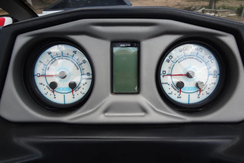 Slide: The Image of Dashboard of a 2020 Axis A22 boat with RPM and speed gauges. - 26