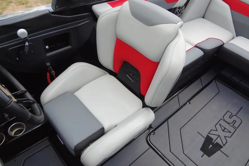 Slide: The Image of 2020 Axis A22 boat interior with red and gray seating, showcasing modern design. - 24