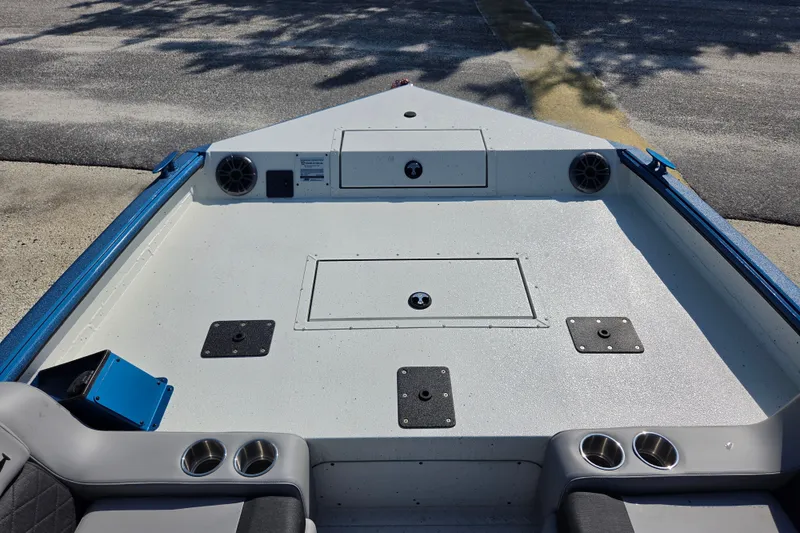 Slide: The Image of 2026 SeaArk Big Easy boat interior with storage compartments and cup holders. - 9