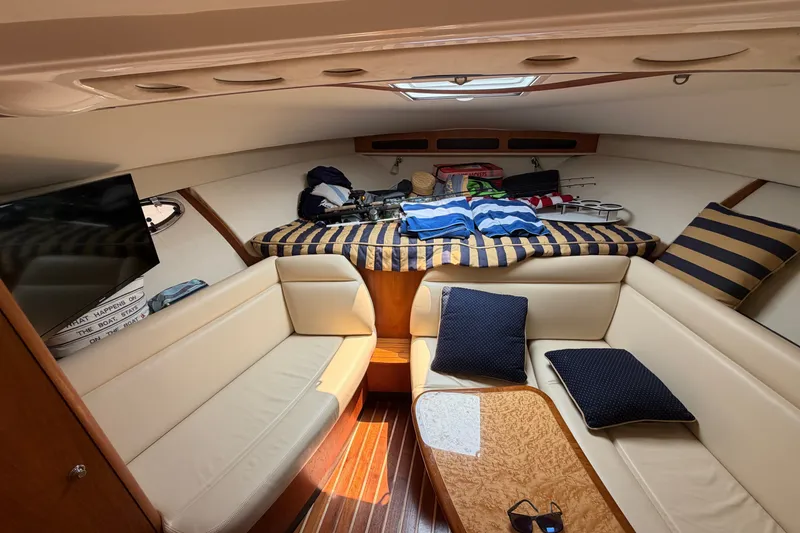 Slide: The Image of Interior of 2008 Tiara Yachts 3000 Open, featuring cozy seating and stylish decor. - 16