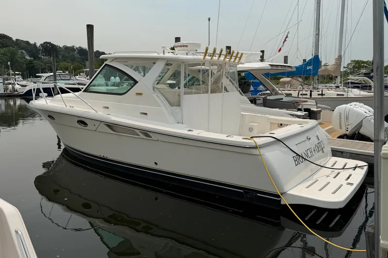 The Image of 2008 Tiara Yachts 3000 Open docked in a marina, showcasing sleek design and luxury features. - 0
