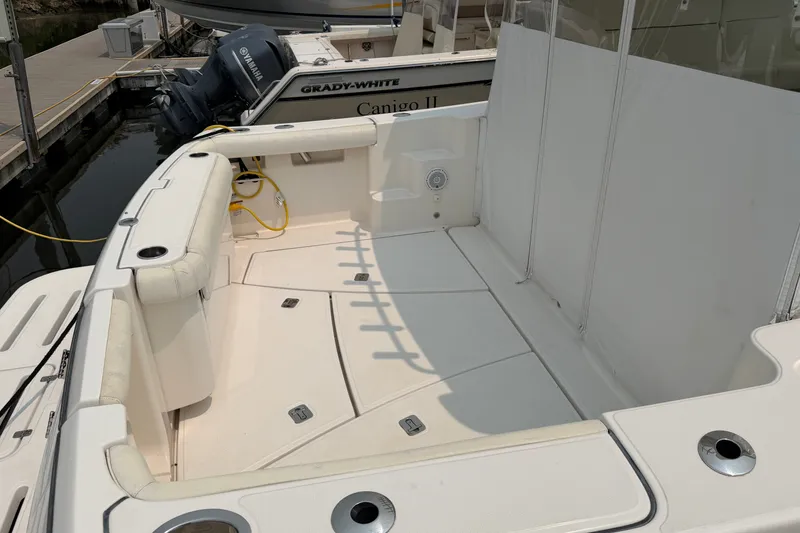 Slide: The Image of 2008 Tiara Yachts 3000 Open boat deck with seating and storage compartments. - 4