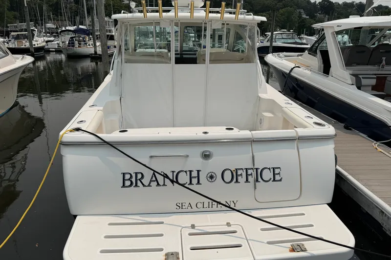 Slide: The Image of 2008 Tiara Yachts 3000 Open docked, named "Branch Office," in Sea Cliff, NY marina. - 2