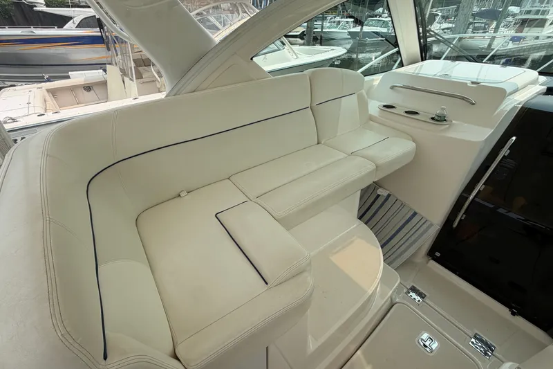 Slide: The Image of 2008 Tiara Yachts 3000 Open interior with white seating and modern design. - 7
