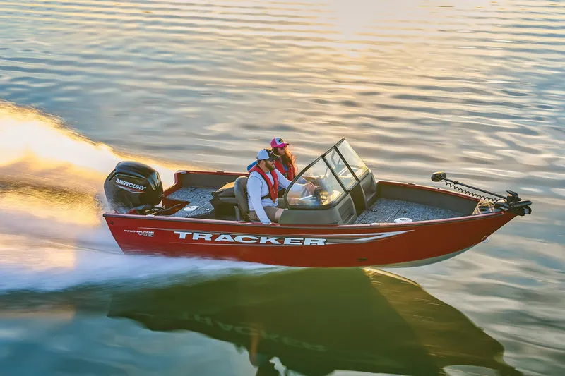 Slide: The Image of Manufacturer Provided Image: 2025 Tracker Pro Guide V-16 WT boat speeding on water at sunset. - 54