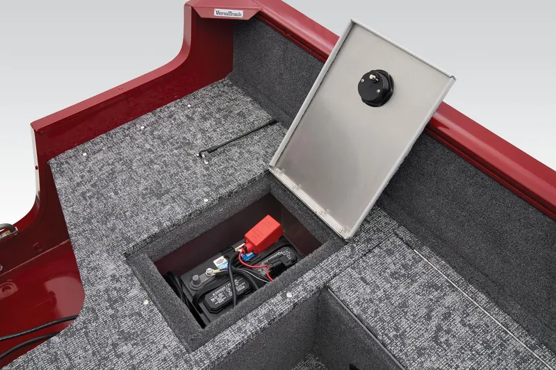 Slide: The Image of Manufacturer Provided Image: 2025 Tracker Pro Guide V-16 WT boat battery compartment with open hatch, red and gray interior. - 44