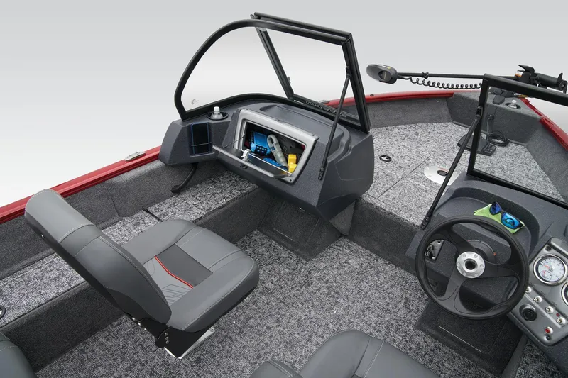 Slide: The Image of Manufacturer Provided Image: 2025 Tracker Pro Guide V-16 WT boat interior with steering wheel and seating. - 36
