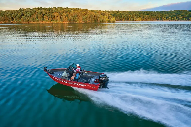 Slide: The Image of Manufacturer Provided Image: 2025 Tracker Pro Guide V-16 WT boat speeding on a serene lake. - 52