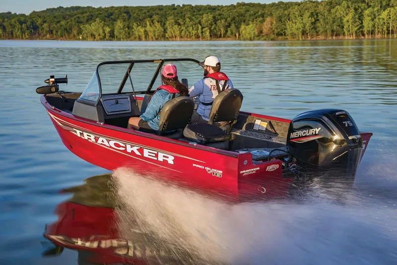 Slide: The Image of Manufacturer Provided Image: 2025 Tracker Pro Guide V-16 WT boat cruising on a lake with two passengers. - 55