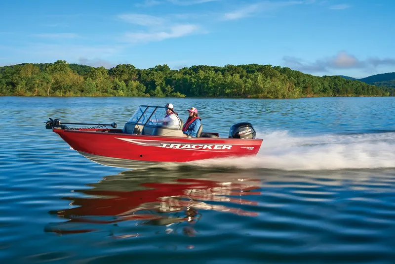 Slide: The Image of Manufacturer Provided Image: 2025 Tracker Pro Guide V-16 WT boat speeding on a serene lake. - 57