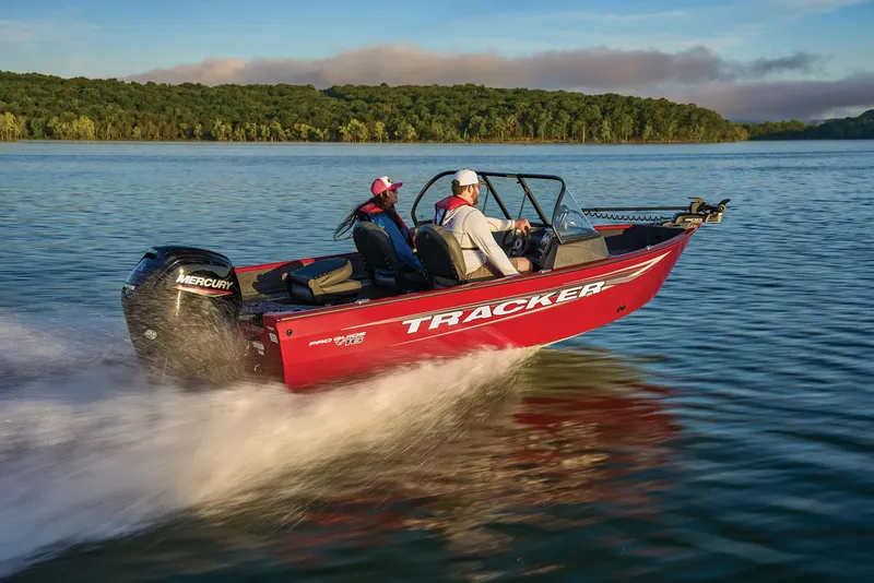 Slide: The Image of Manufacturer Provided Image: 2025 Tracker Pro Guide V-16 WT boat cruising on a scenic lake. - 56
