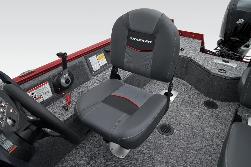 Slide: The Image of Manufacturer Provided Image: 2025 Tracker Pro Guide V-16 WT boat interior with gray seating and steering console. - 29