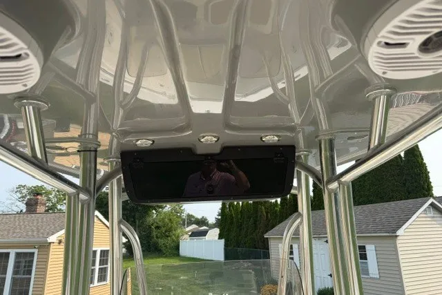 Slide: The Image of 2021 Bulls Bay 230 Center Console boat interior with speakers and overhead console. - 29