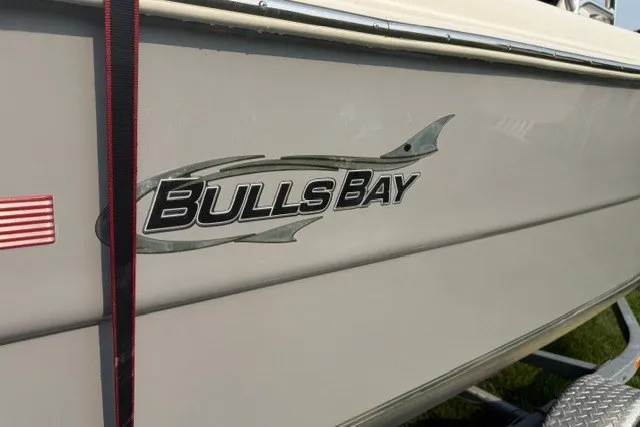 Slide: The Image of 2021 Bulls Bay 230 Center Console boat logo on side view. - 34