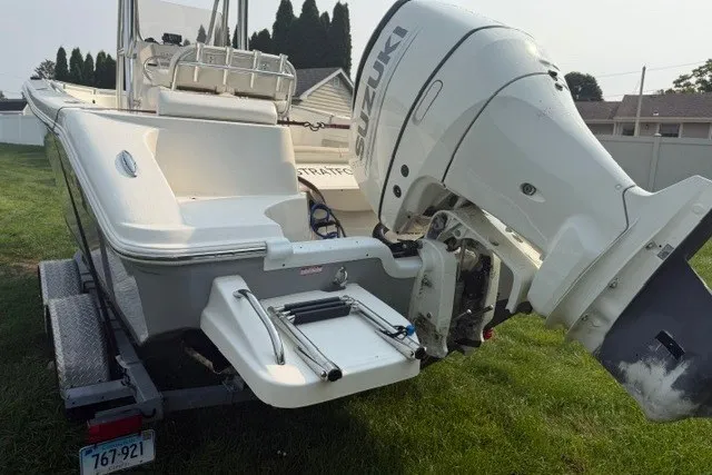 Slide: The Image of 2021 Bulls Bay 230 Center Console boat with Suzuki outboard motor on trailer. - 37