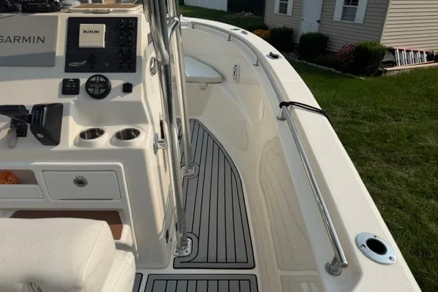 Slide: The Image of 2021 Bulls Bay 230 Center Console boat interior with navigation equipment and seating. - 28