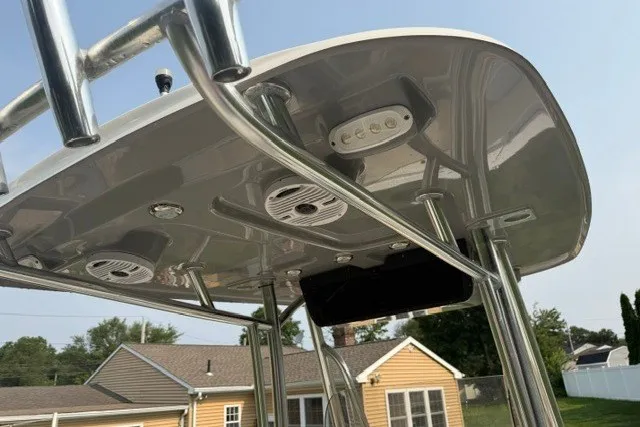Slide: The Image of 2021 Bulls Bay 230 Center Console T-top with mounted lights and speakers. - 26