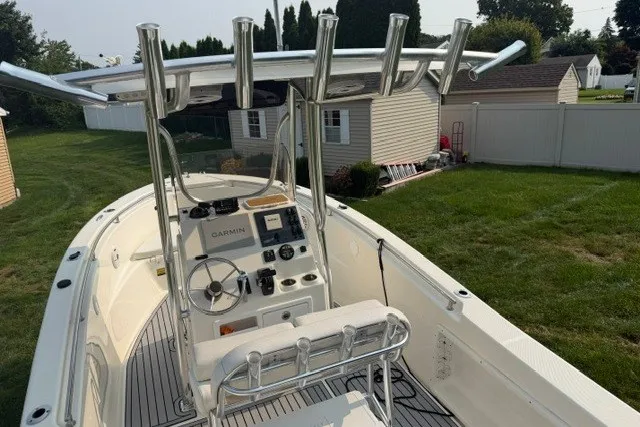 Slide: The Image of 2021 Bulls Bay 230 Center Console boat with Garmin navigation, parked in a grassy yard. - 33