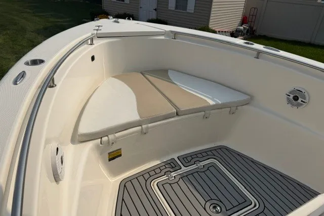 Slide: The Image of 2021 Bulls Bay 230 Center Console boat interior with cushioned seating and non-slip flooring. - 24