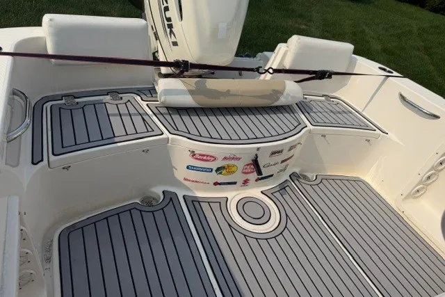 Slide: The Image of 2021 Bulls Bay 230 Center Console boat deck with Suzuki engine and custom flooring. - 16