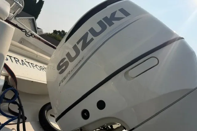 Slide: The Image of 2021 Bulls Bay 230 Center Console with Suzuki outboard motor in close-up view. - 35