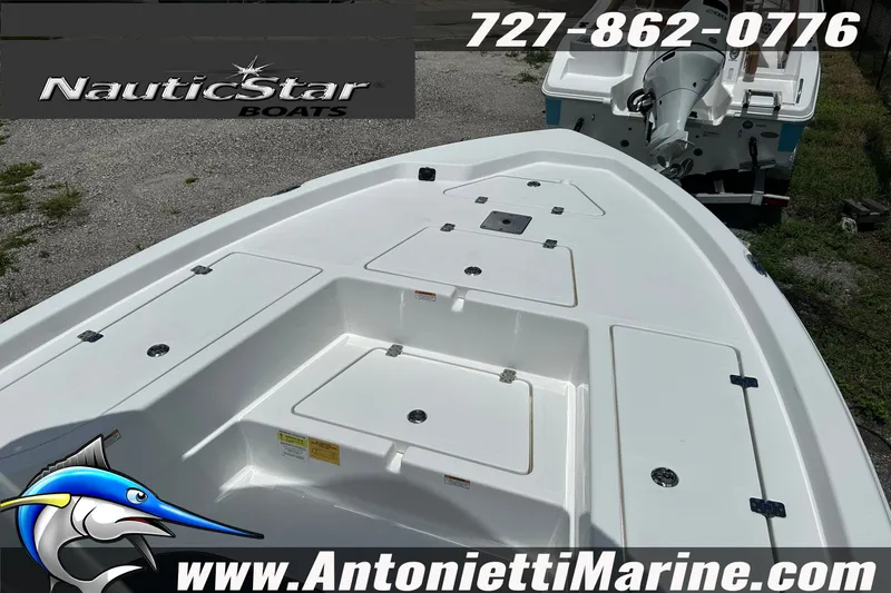 Slide: The Image of 2024 NauticStar 214 Bay boat deck with storage compartments, displayed by Antonietti Marine. - 12