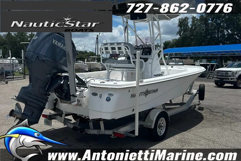 Slide: The Image of 2024 NauticStar 214 Bay boat with Yamaha engine on trailer at dealership. - 4