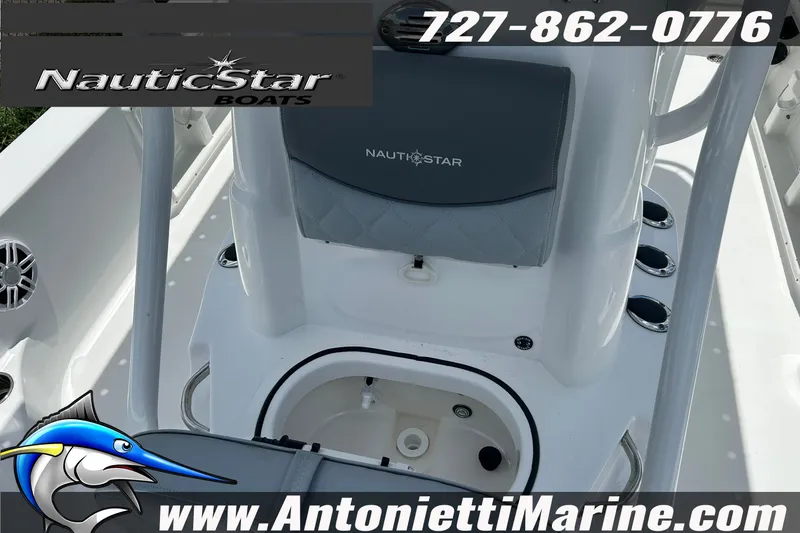 Slide: The Image of 2024 NauticStar 214 Bay boat interior with seating and storage, featuring Antonietti Marine branding. - 20