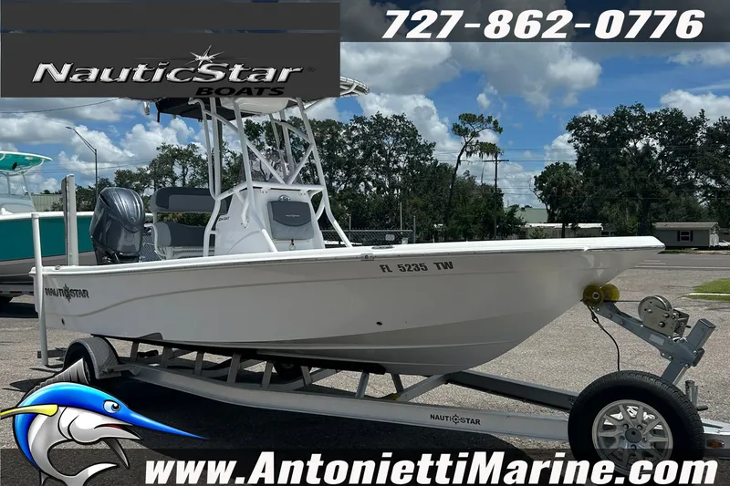 Slide: The Image of 2024 NauticStar 214 Bay boat on trailer at Antonietti Marine dealership. - 3