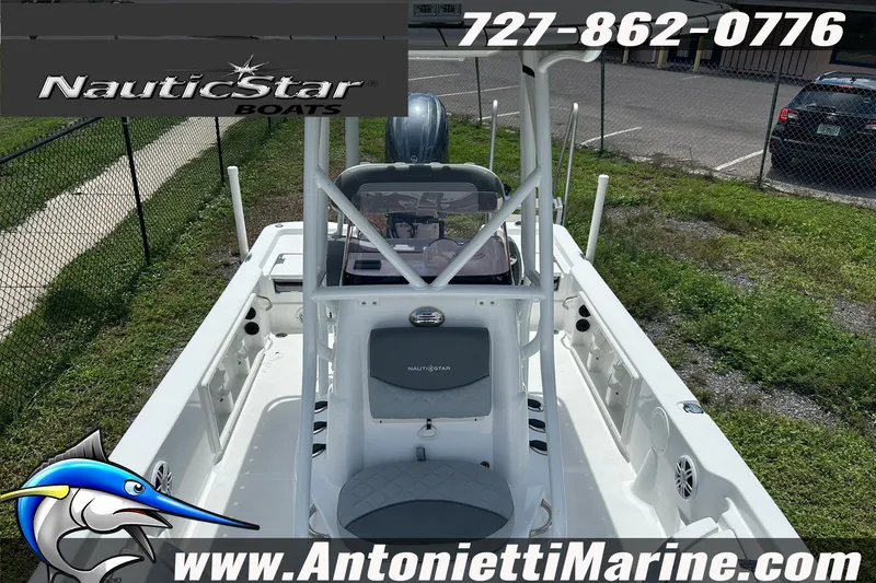 Slide: The Image of 2024 NauticStar 214 Bay boat displayed at Antonietti Marine dealership. - 9