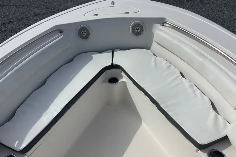 Slide: The Image of Interior seating of a 2015 Tidewater 210 LXF boat with white cushions. - 9