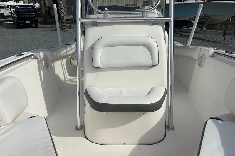 Slide: The Image of 2015 Tidewater 210 LXF boat interior with white seating and console. - 10