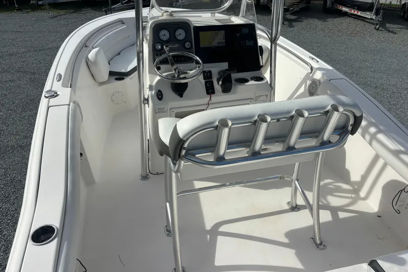 Slide: The Image of 2015 Tidewater 210 LXF boat interior with steering console and seating. - 6