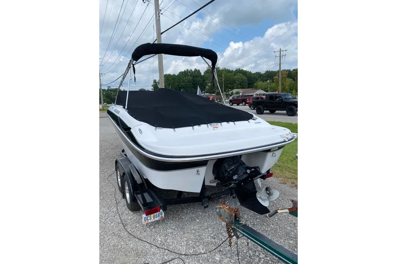Slide: The Image of 2008 Four Winns H220 boat on trailer with black cover - 13